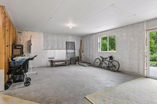 Welcome to the walkout lower level! This unfinished space is ready for your vision and future finishing touches.
