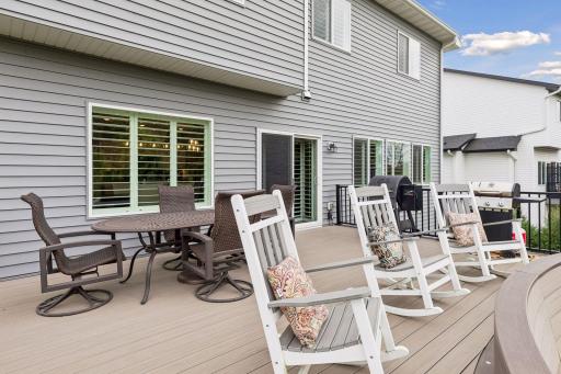 Step outside from the kitchen onto the oversized maintenance-free deck—an incredible extension of the home’s entertaining space.