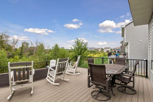 The deck overlooks 5 acres of city-owned land, creating a wonderfully private and peaceful backdrop.