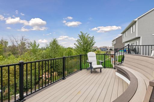 This unique two-tier deck features built-in bench seating and plenty of room for dining, lounging, and entertaining.