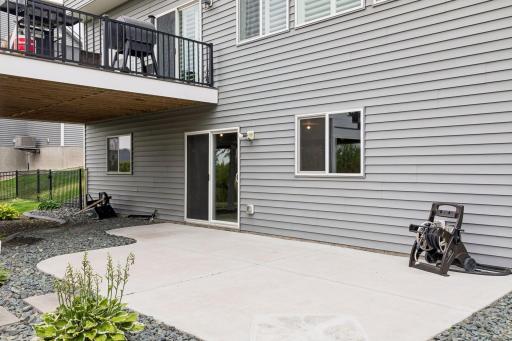 The walkout lower level opens to a large concrete patio surrounded by beautiful landscaping.