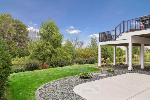 The landscaping surrounding this home is truly beautiful and adds so much to the backyard setting.