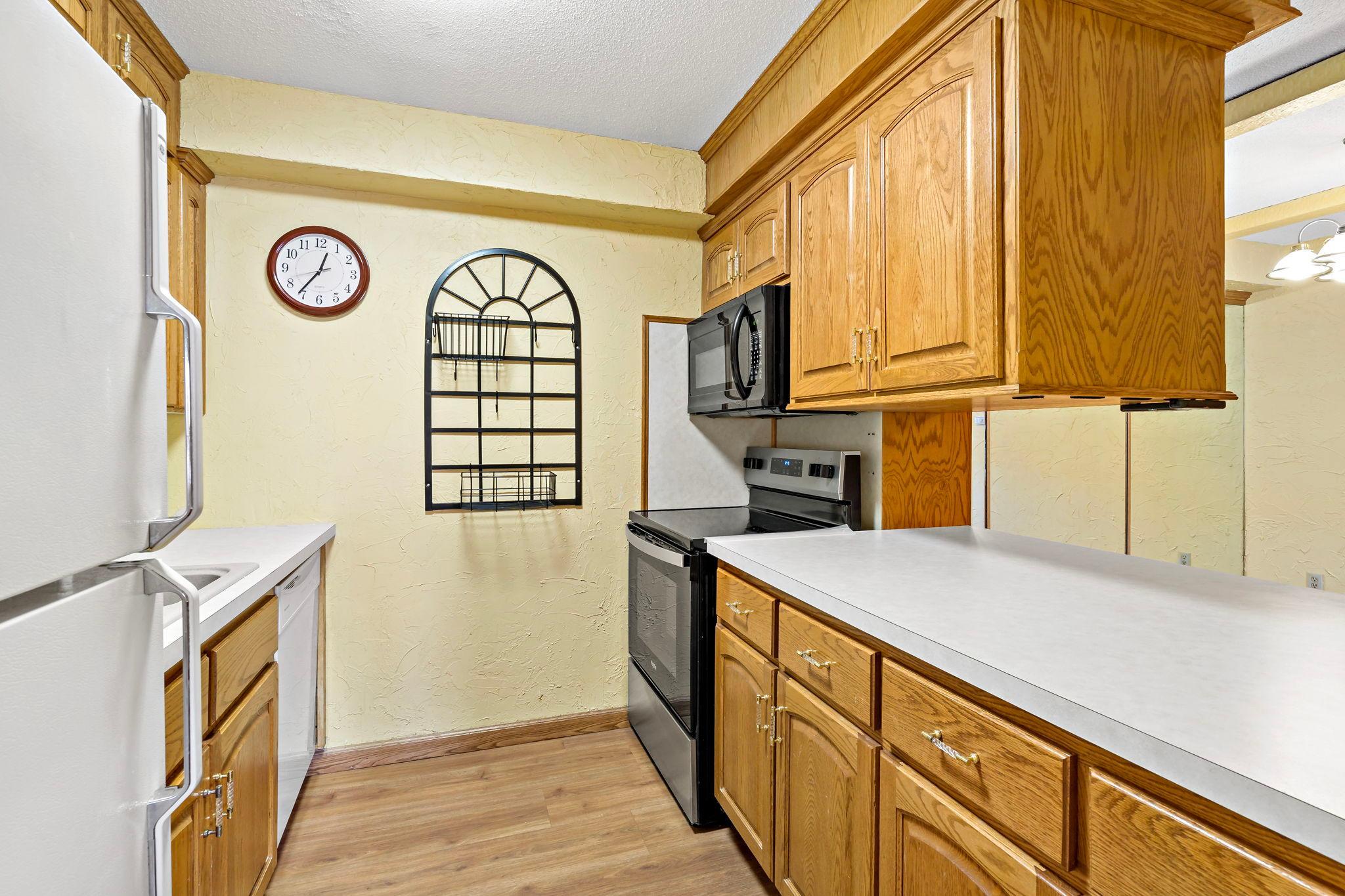 Kitchen with pass-through to dining area is convenient.