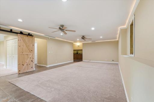 The expansive lower level boasts in floor heat, a 4th bedroom and 1/2 bath.
