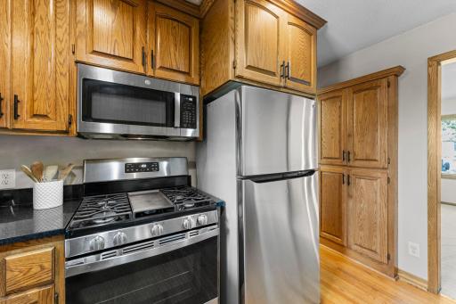 Most of the appliances are newer including the gas stove. Notice the pantry in the hallway for additional storage space!