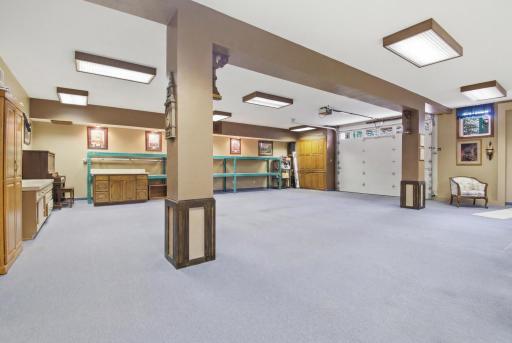 Expansive finished lower-level flex/garage space with multiple potential uses.