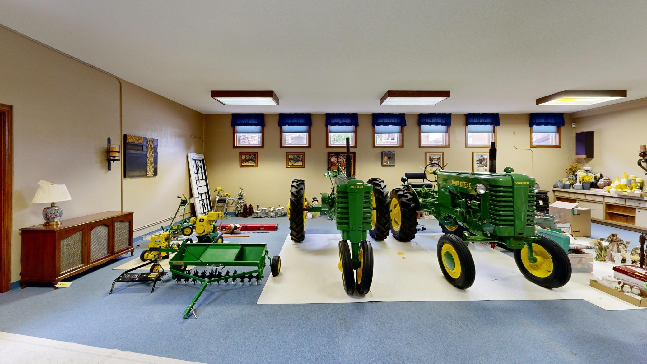Expansive finished lower-level flex/garage space with multiple potential uses.