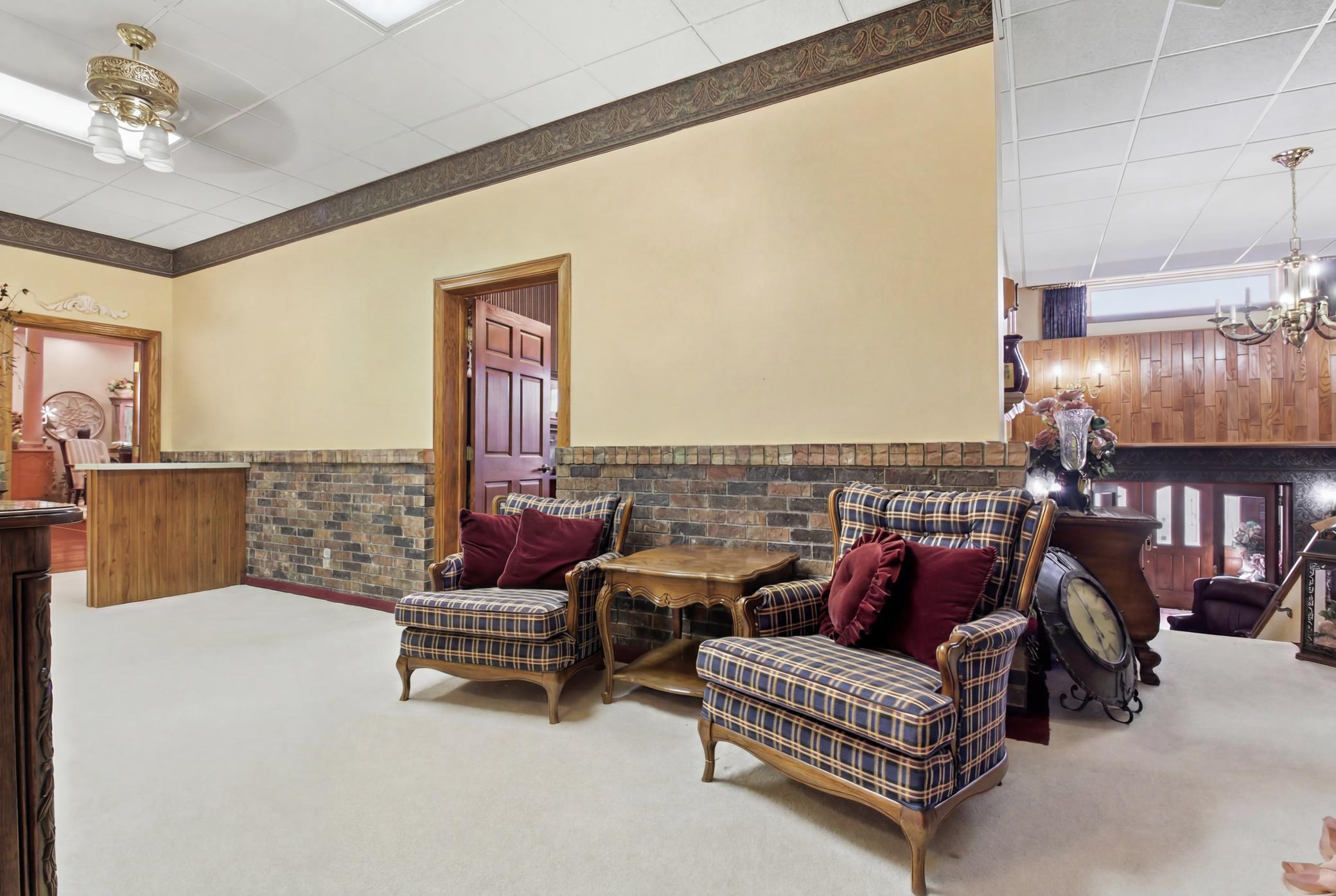 Open upper-level gathering space with multiple adjoining rooms and abundant flexibility.