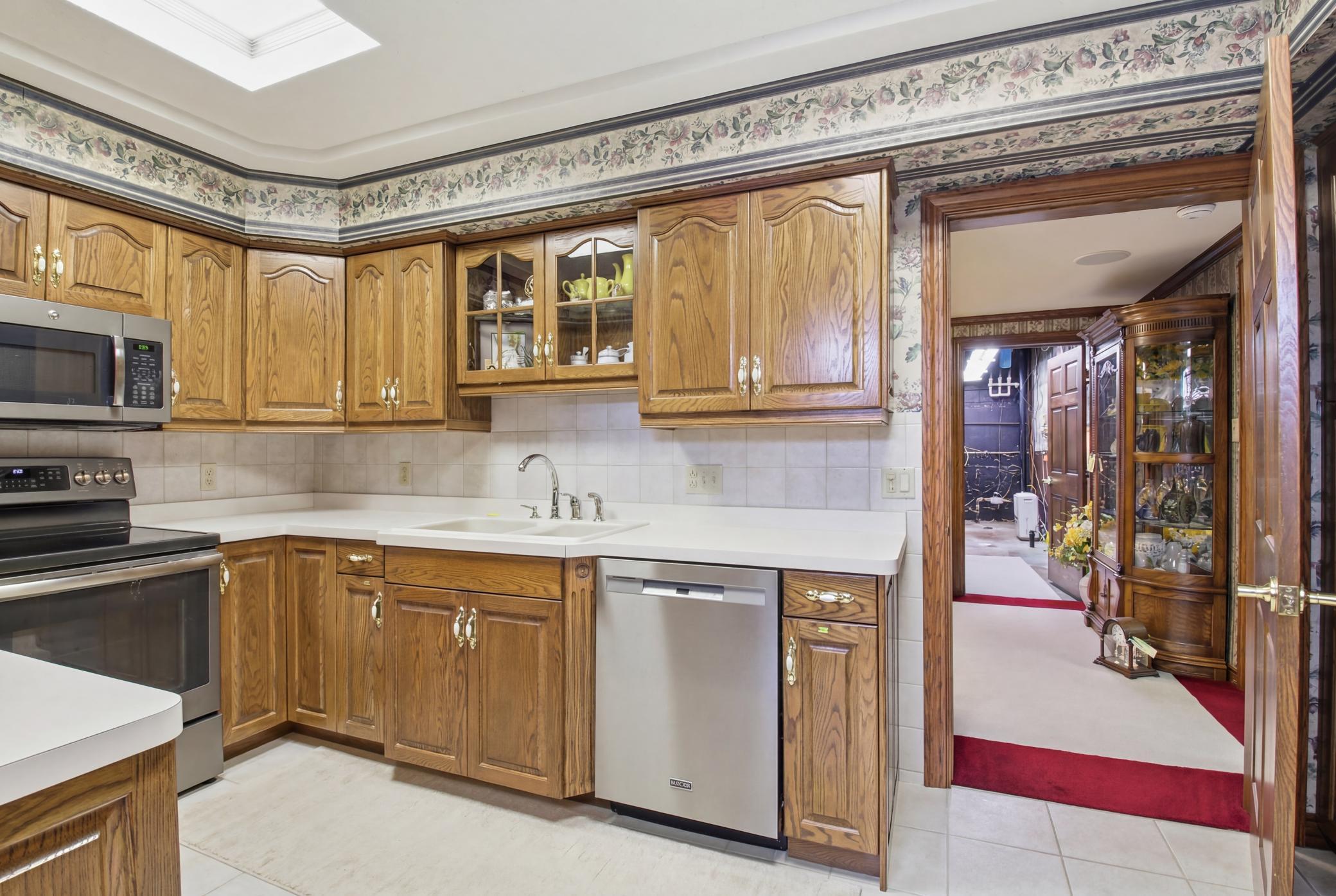 Spacious kitchen/dining with generous cabinetry, functional layout potential, and gas fireplace