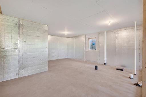 The front portion of this basement with the egress window is for bedroom #4 and next to it is the rough in drain lines for a future 3/4 bath.