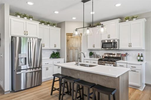 The kitchen has lots of custom built Popal cabinetry, LED downlighting and a stainless steel kitchen appliance package.