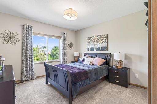 The primary bedroom in the back of the house that overlooks a nice wetlands.
