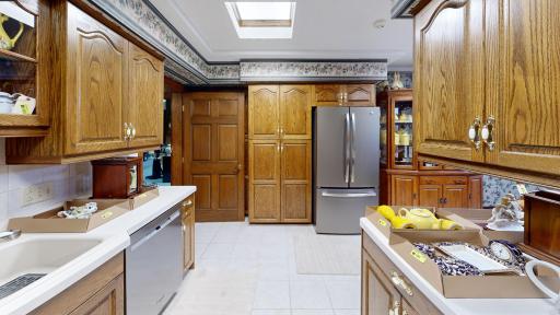Spacious kitchen/dining with generous cabinetry, functional layout potential, and gas fireplace