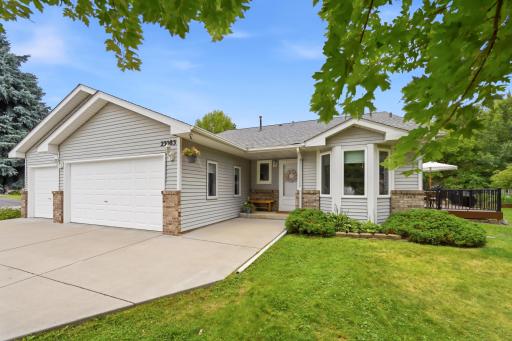 The concrete driveway is large enough for parking your trailer or 5th wheel. Notice the covered entryway?