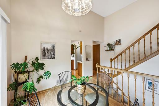 Dining are has vaulted ceilings which lead to the living room.