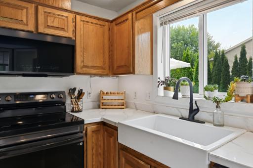 A Farmer's sink and new faucet give character to the kitchen.