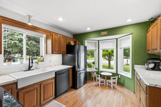 A bay window lets additional sunlight in and offers an extended kitchen space.