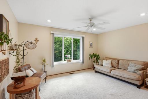 Notice the lush green views from the windows. The neighborhood offers mature trees and larger lot sizes.
