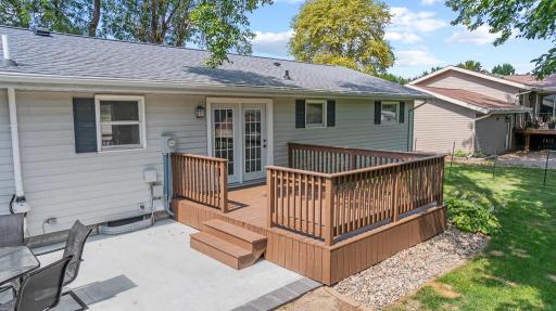 Back deck will easily accommodate some patio furniture, seasonal outdoor decor, and plants.