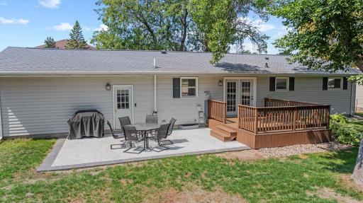 No shortage of space to unwind with a spacious back patio and deck, a peaceful backyard, and multiple living spaces within!