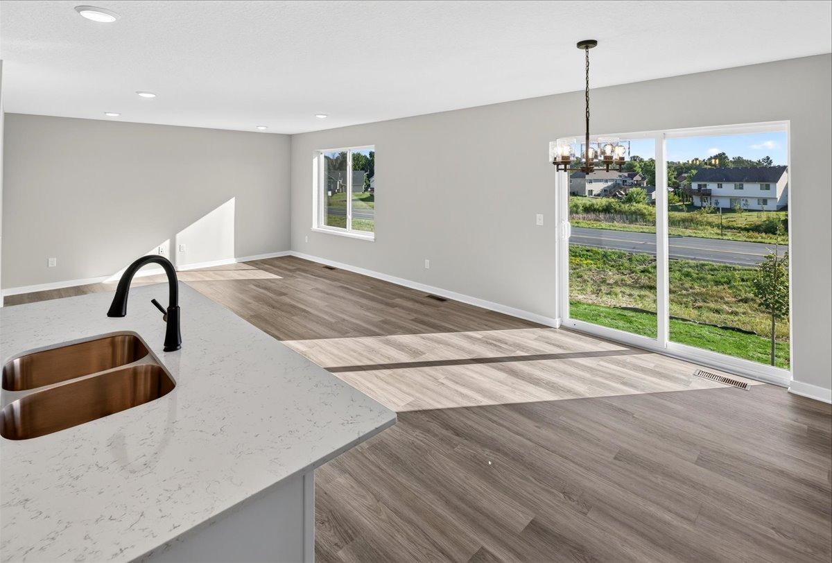 Open Concept. Photo taken of another home with similar plan and finishes.