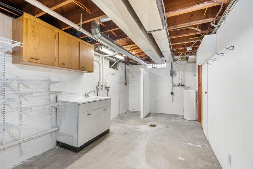 Utility Room with Shower and Lower Level Toilet Room