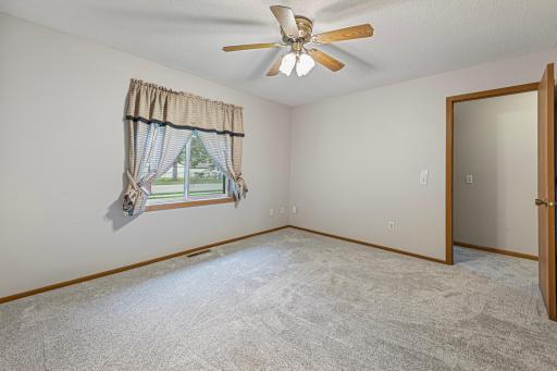 Primary bedroom with ceiling fan