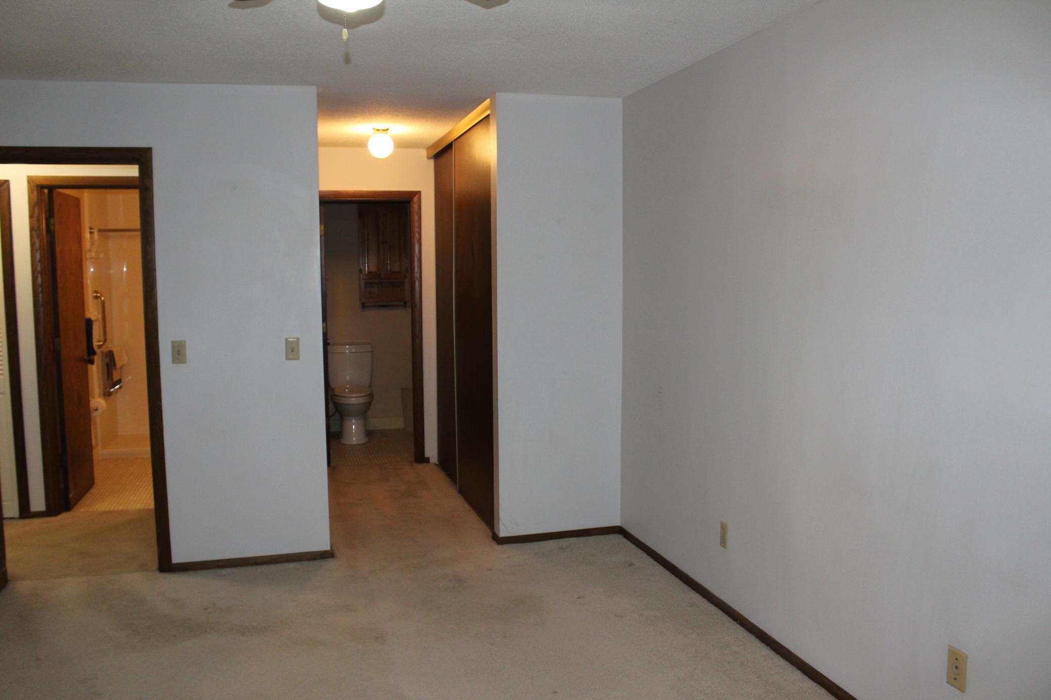 Hallway to Primary and full bath