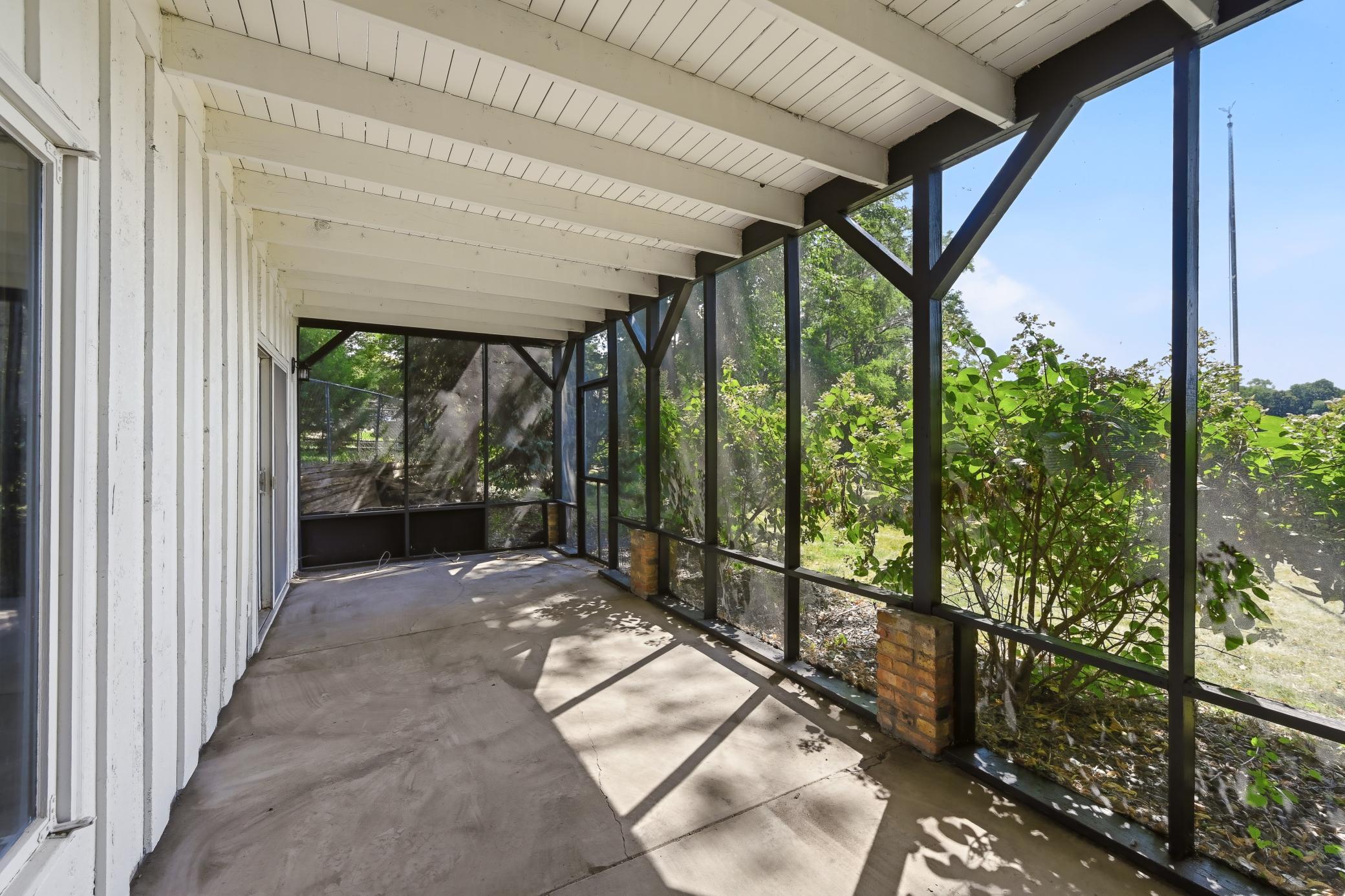Patio was professionally painted. Enter your backyard through the screened door!