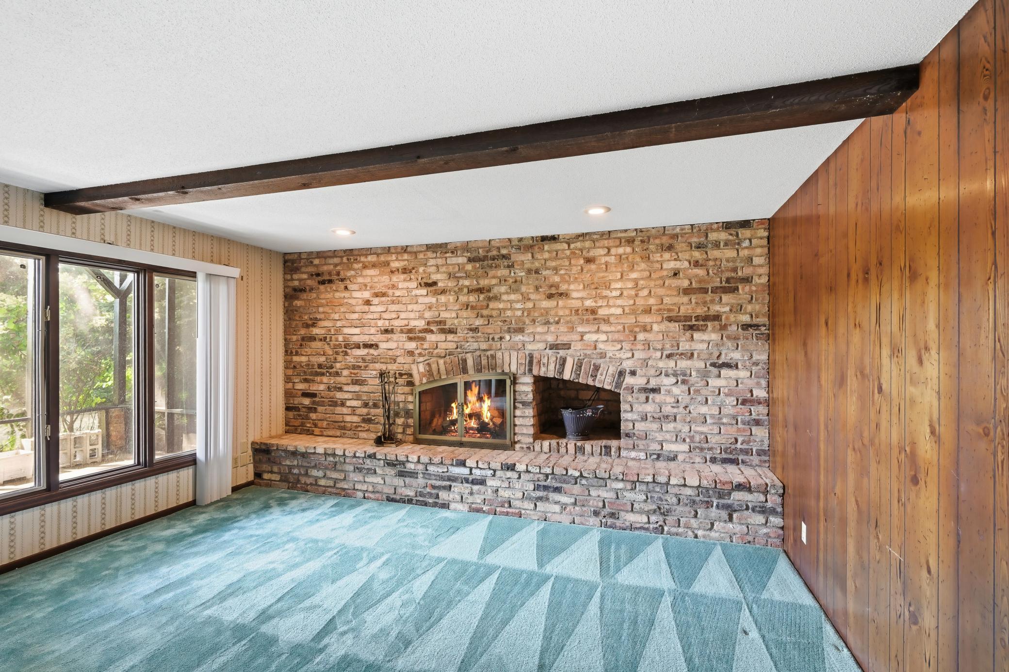 Wood beam ceiling. Walk out to your screened in patio!