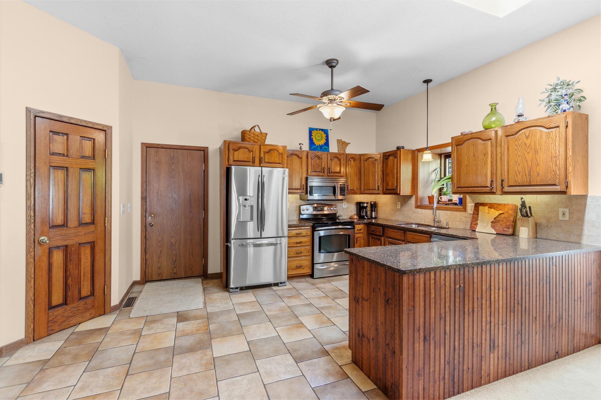 Kitchen has stainless steel appliances.