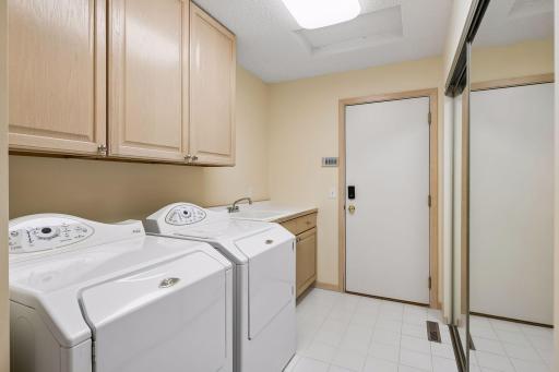 LAundry & Dropzone just inside from garage with more storage