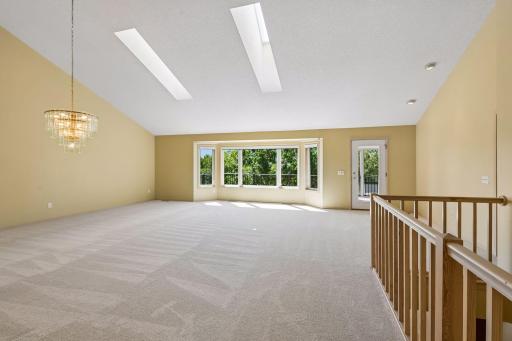 Stairs down to lower level are extra wide and gracious