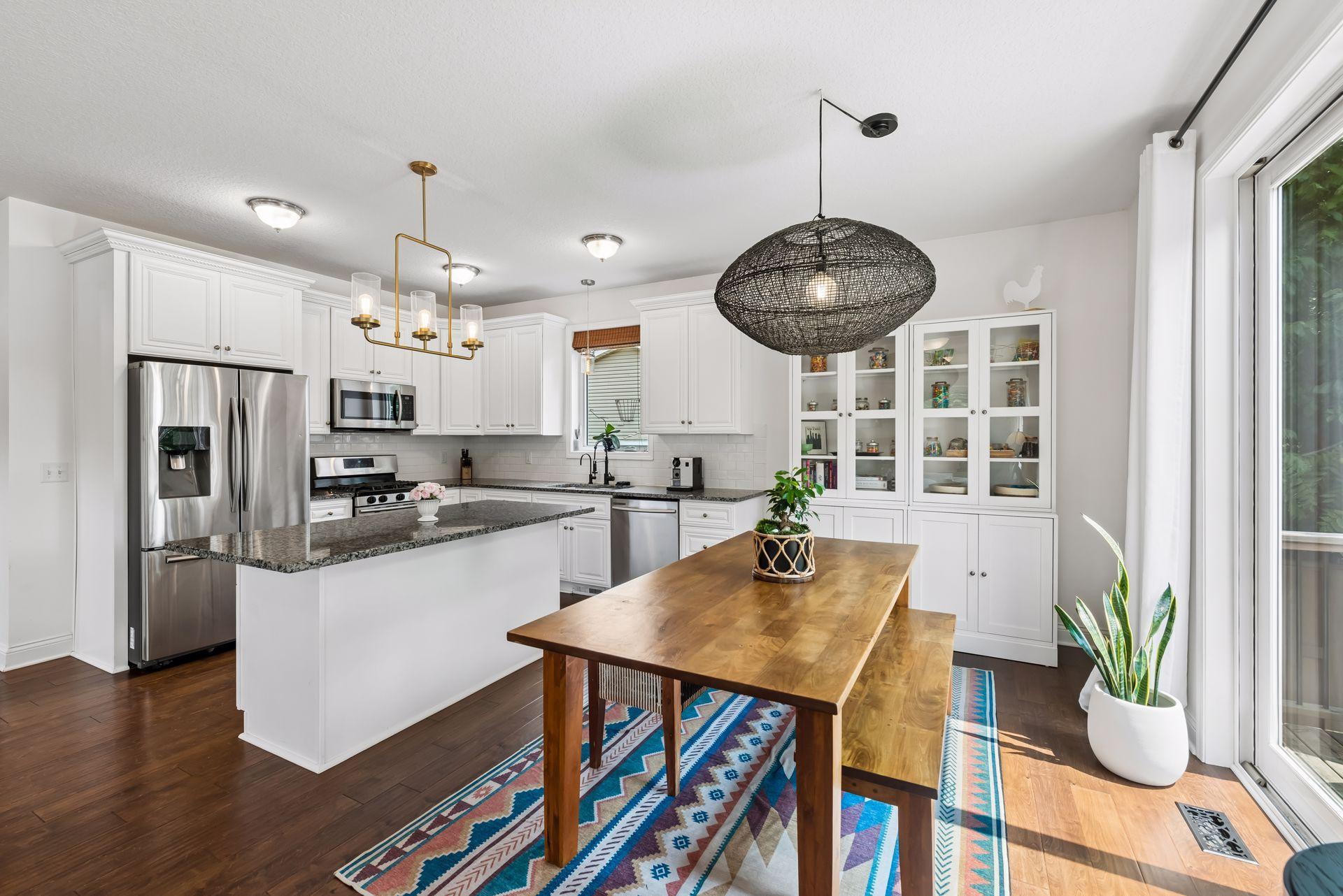 The spacious dining area is filled with natural light and offers easy access to the expansive deck, creating the perfect indoor-outdoor flow for family dinners or entertaining guests.