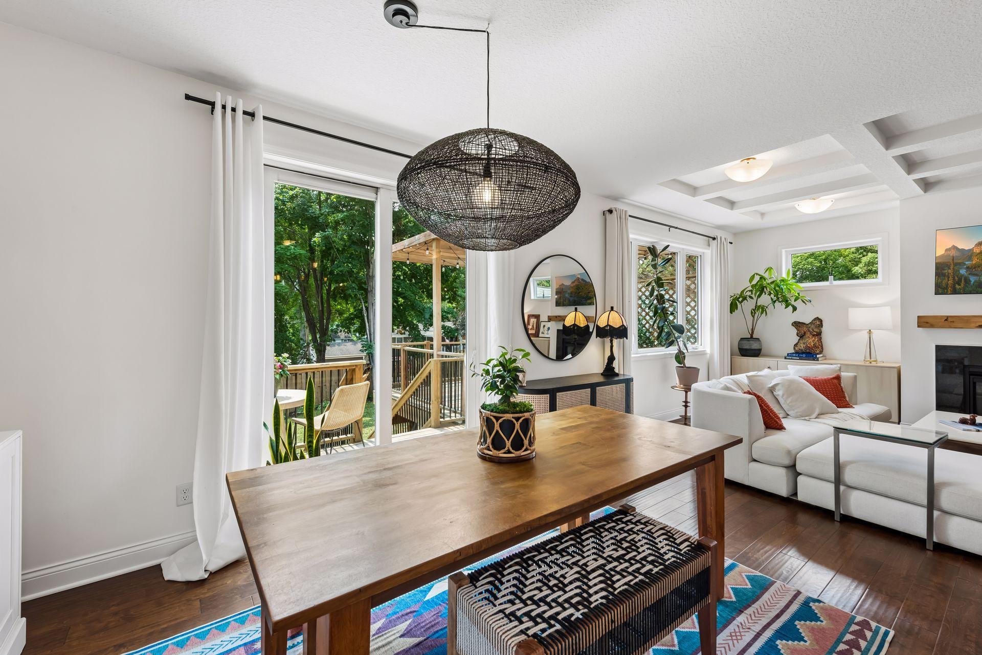Host memorable gatherings with dining just steps from the deck and pergola. Large sliding doors invite sunshine inside while providing beautiful views of the private backyard.