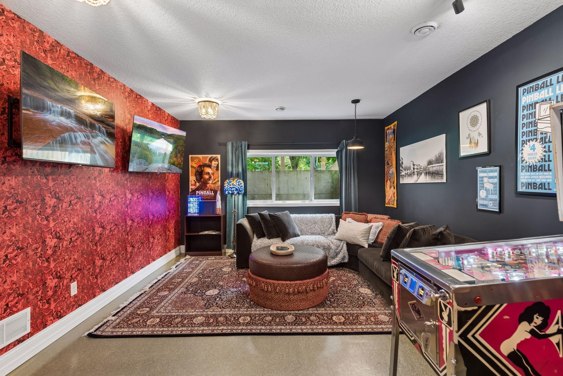 The open-concept lower level seamlessly blends living and recreation spaces, offering flexibility for entertaining on any scale.