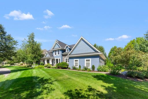 Located on a private corner lot with mature trees and beautiful professional landscaping.