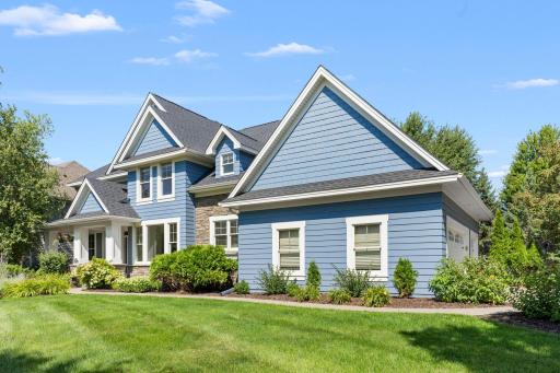 The home features a 3-car attached side-load garage. The exterior, trim, and garage doors were freshly painted last year.