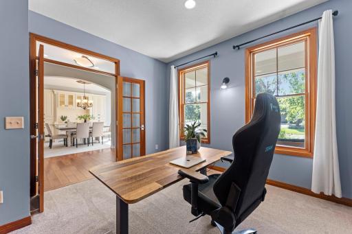 Enter the office through glass French doors.