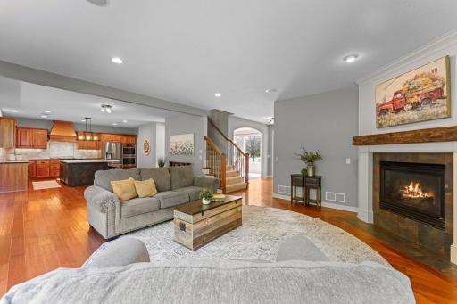 A view of the open layout between the living room, informal dining room and kitchen.