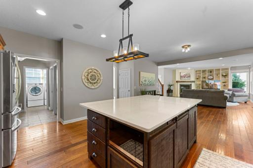Great view of the custom kitchen island. Just off the kitchen is the garage service door, mudroom, laundry room, powder room and walk-in pantry closet.
