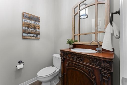 The main level includes a convenient powder room off the mudroom.