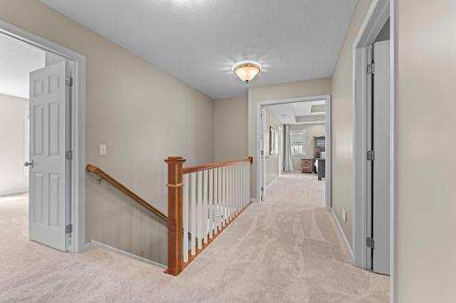 The upper level includes brand-new carpet. Four of the bedrooms are on the upper level. The hallway includes a large linen closet.