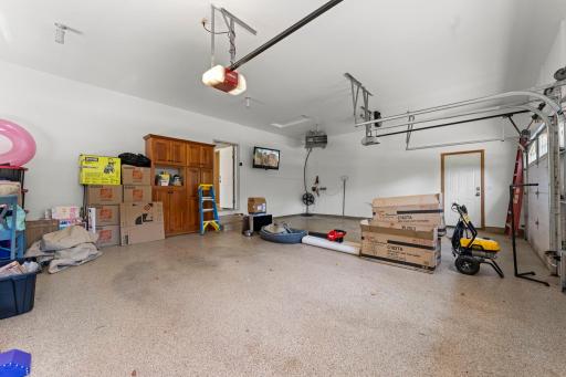 The garage features two service doors - one into the home's mudroom and one to the backyard.