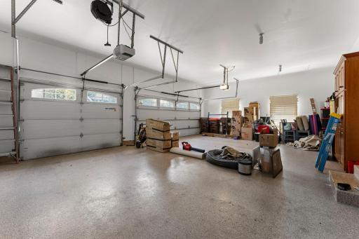 The heated garage features epoxy floors and a high 10-ft ceiling. There is plenty of room for storage. The garage door openers can be controlled by your smartphone.