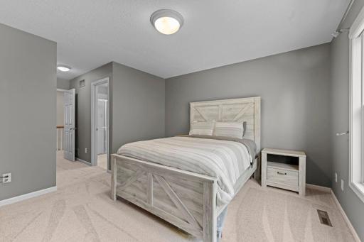 This bedroom features it's own private 3/4 bathroom and a walkl-in closet.
