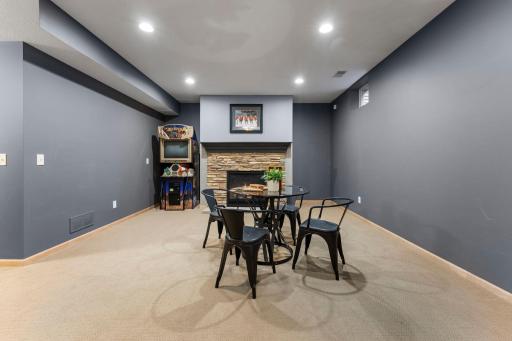 The lower level includes a lighted stairway, recessed lights, and a large storage closet.