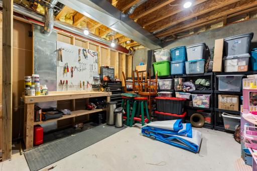 The mechanical room includes a storage bench and loads of space for your storage needs.