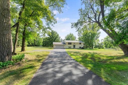 Home sits off the road and on a corner lot