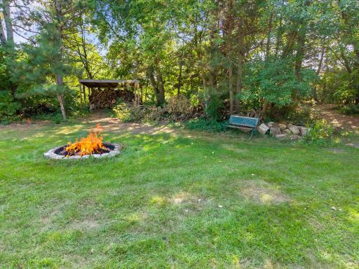 Towards the back of the yard also has a great firepit area.